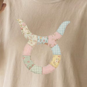 May include: A set of three ceramic mugs with a speckled, matte finish. The mugs are in shades of cream, light gray, and dark gray. Each mug has a simple, minimalist design, perfect for coffee or tea.