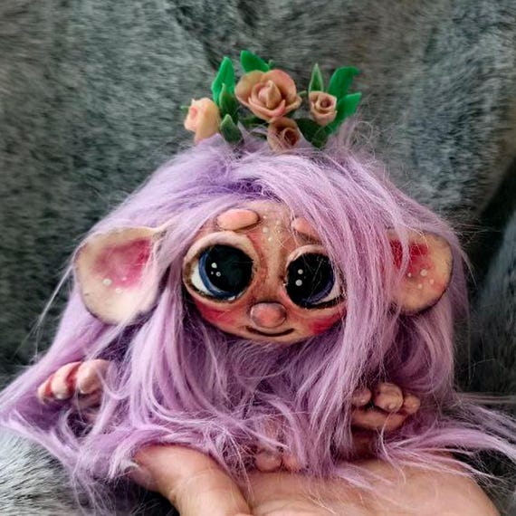 A one-of-a-kind handmade 'weird little creature' that lives on your shelf and silently judges everyone — the kind of thing you can't stop staring at.