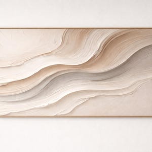 May include: A rectangular wall art piece featuring thick, textured impasto paint strokes in shades of cream, beige, and soft taupe. The paint creates flowing, wave-like patterns across the canvas, which is enclosed in a thin, light-toned wooden frame.