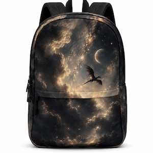 May include: A black backpack featuring a printed design of a dark, cloudy night sky with a crescent moon and a silhouette of a flying dragon. The bag includes black shoulder straps, a top handle, and a front zippered pocket with black zipper pulls.