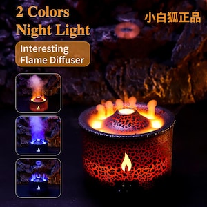 Peut inclure: Diffuseur de flamme et veilleuse avec un design en forme de volcan. Le produit présente un extérieur texturé rouge et noir, avec une lumière en forme de flamme et le texte "Interesting Flame Diffuser". Le produit a deux options de couleur.