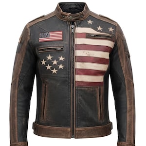 May include: A distressed leather jacket with an American flag design. The jacket features a black body with brown accents and a zipper closure. The flag design is on the chest and shoulder, with stars and stripes.