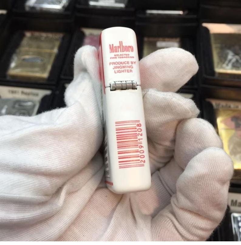 May include: A white and red Marlboro lighter with the text "Marlboro Selected Fine Tobaccos" and "Produce by Jingming Lighter". The lighter has a barcode and the number "20091208" printed on it.