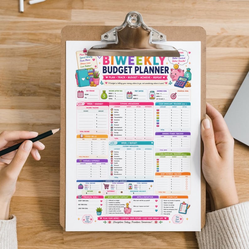 May include: A biweekly budget planner sheet on a clipboard with a black pen. The document features colorful sections for income, expense breakdown, cash envelope tracking, debt payment, and financial goals with icons of a piggy bank and calculator.