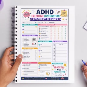 May include: ADHD Executive Dysfunction Recovery Planner with a spiral binding. The planner includes sections for daily priorities, executive function check-ins, task breakdowns, and time blocking. The cover features colorful graphics and the text "Progress, Not Perfection."