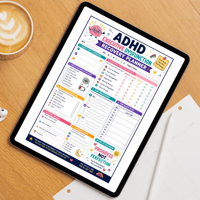 May include: A digital tablet displaying an ADHD Executive Dysfunction Recovery Planner. The planner features sections for daily priorities, executive function check-ins, task breakdowns, and a time block plan. The planner's design includes colorful graphics and motivational text.