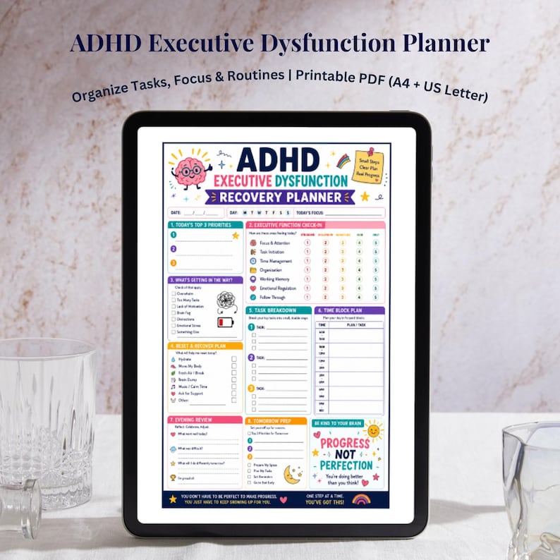 May include: A digital ADHD Executive Dysfunction Recovery Planner displayed on a tablet. The planner features sections for daily priorities, executive function check-ins, task breakdowns, and evening reviews. The planner's design includes colorful graphics and the text "Progress, Not Perfection."