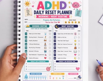 May include: A spiral-bound ADHD daily reset planner with morning and night routine sections. The planner includes sections for tasks, water tracking, and energy levels. The cover features the text "ADHD" and "Daily Reset Planner".