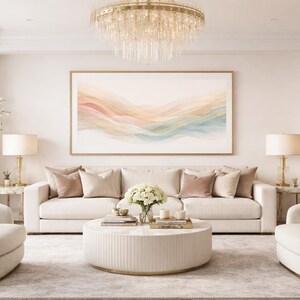 May include: A luxurious living room with a neutral color palette. Features include a large sofa with decorative pillows, two armchairs, a round coffee table, and a large abstract painting. A chandelier and lamps provide soft lighting.