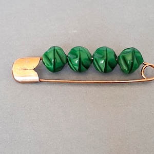 Vintage safety pin  with green glass beads, Gold tone metal brooch