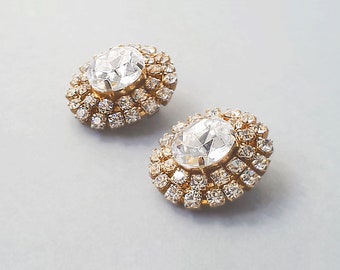 Vintage gold tone  clip-on earrings with  clear rhinestones