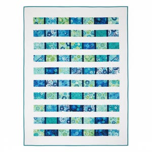 May include: A rectangular quilt featuring horizontal rows of alternating blue and green floral patterned fabric blocks separated by solid white strips. The entire quilt is framed by a thin teal border, creating a structured, repeating design.