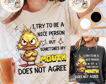 May include: A cream-coloured t-shirt featuring a graphic of an angry yellow chick with crossed arms. The text reads: I TRY TO BE A NICE PERSON BUT SOMETIMES MY MOUTH DOES NOT AGREE. The word MOUTH is highlighted in yellow with a black outline.