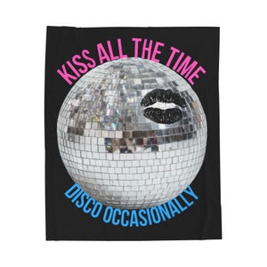 May include: A black blanket featuring a disco ball with a black lipstick kiss mark. The text "KISS ALL THE TIME" is in pink, and "DISCO OCCASIONALLY" is in blue.
