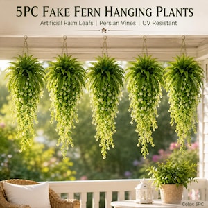 May include: Five artificial hanging fern plants with green palm leaves and Persian vines, featuring small white flowers. The text reads 5PC FAKE FERN HANGING PLANTS, Artificial Palm Leafs | Persian Vines | UV Resistant. Each plant hangs from a metal chain.