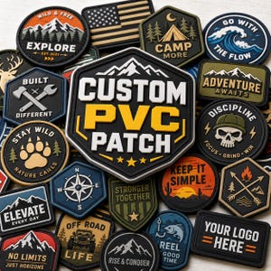 May include: A collection of various PVC patches in different shapes and designs. The patches feature text like "Explore", "Adventure Awaits", and "Custom PVC Patch". Colors include black, white, yellow, and various shades of green and blue. Some patches have mountain and outdoor themes.