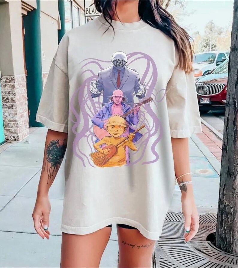 May include: A set of three ceramic mugs with a speckled, matte finish. The mugs are in shades of cream, light gray, and dark gray. Each mug has a simple, minimalist design and a rounded handle.