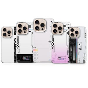 May include: Five white phone cases with a geometric design. Each case has a different design, including lines, shapes, and text. The cases have a clear border around the camera.