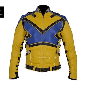 May include: Yellow and blue leather jacket with black accents. The jacket features a blue chevron design on the chest and black trim. It has a black belt and multiple buckles. The Movie Outfitters logo is visible.