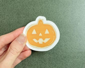 Pumpkin cookie sticker | frosting, sweet treat, Halloween, fall, autumn, jack-o’-lantern, dessert, spooky season, sugar cookie, orange