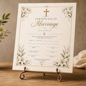 May include: A cream-coloured marriage certificate printed with gold borders, a central gold cross, and floral illustrations in the corners. The text reads Certificate of Marriage, This is to certify that, and includes lines for names, dates, and signatures.