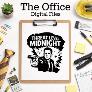May include: A clipboard with a black and white graphic that says "Threat Level Midnight" with a man holding a gun. The image is surrounded by office supplies, including a mug that says "World's Best Boss".