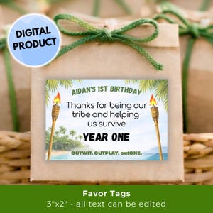 May include: Favor tags with a tropical theme. The tags read "AIDAN'S 1ST BIRTHDAY" and "Thanks for being our tribe and helping us survive YEAR ONE." The tags are 3"x2" and feature a beach scene with torches.