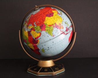 Vintage rotating tin world globe