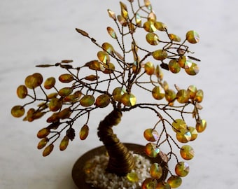 vintage brass wire tree with brass tone leaves, brass wire trunk and branches mounted on a brass base