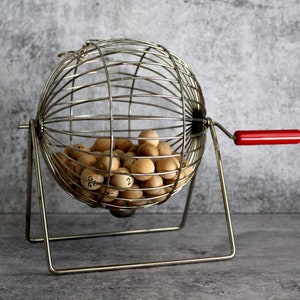 vintage large metal bingo cage with wooden balls, classic game