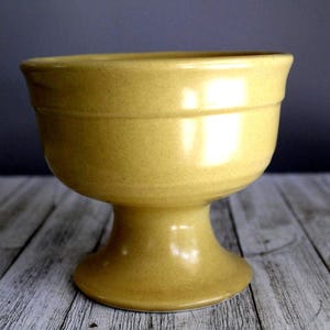 vintage footed pottery planter in yellow
