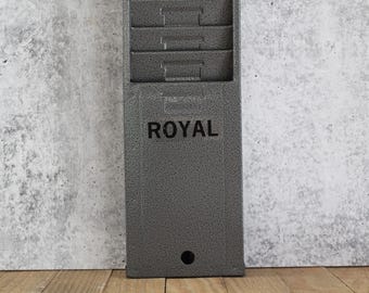 vintage ROYAL 12 slot time card holder that was used in an office setting