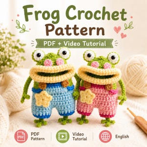 May include: Two crocheted green frogs with large eyes, pink cheeks, and wide mouths. One wears blue overalls with a yellow star, the other pink overalls with a yellow star. Text reads Frog Crochet Pattern, PDF + Video Tutorial, English.