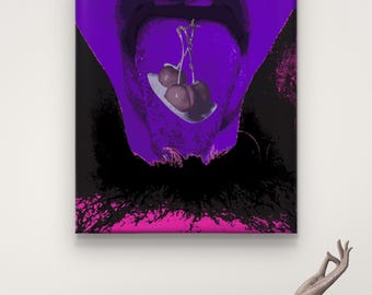 May include: A canvas print featuring a close-up of a mouth with a purple tongue holding cherries. The background is a vibrant purple, with black and pink accents. The artwork is mounted on a white wall.