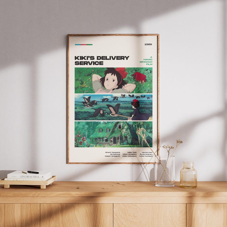 May include: A framed poster featuring scenes from the animated film "Kiki's Delivery Service." The poster has a beige background with the title and film details in black and green. The artwork depicts Kiki and other characters in various scenes.