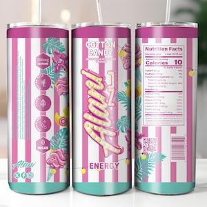 Peut inclure: Un gobelet Alani Nu Energy saveur barbe &agrave; papa &agrave; rayures roses et blanches avec une paille. Le gobelet pr&eacute;sente le texte "Alani Energy" et "Cotton Candy". Le gobelet contient &eacute;galement des informations nutritionnelles et d'autres graphiques.