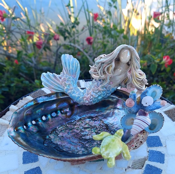 Rainbow Mermaid resting on a Abalone shell