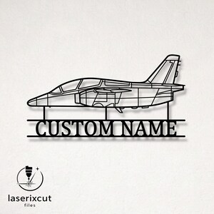 May include: A black metal wall art piece featuring the side profile silhouette of a jet aircraft. Below the aircraft, two horizontal lines frame the text CUSTOM NAME in a bold, serif font. The design is connected by two vertical supports.
