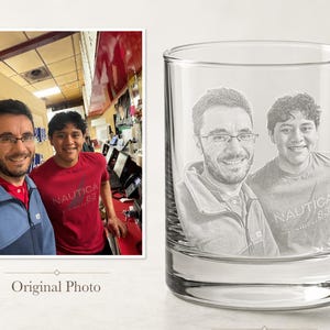 May include: A clear glass tumbler featuring a laser-engraved portrait of two individuals based on the original photo shown to the left. The engraving captures the facial features and upper torsos of both people, including the text Nautica 83.