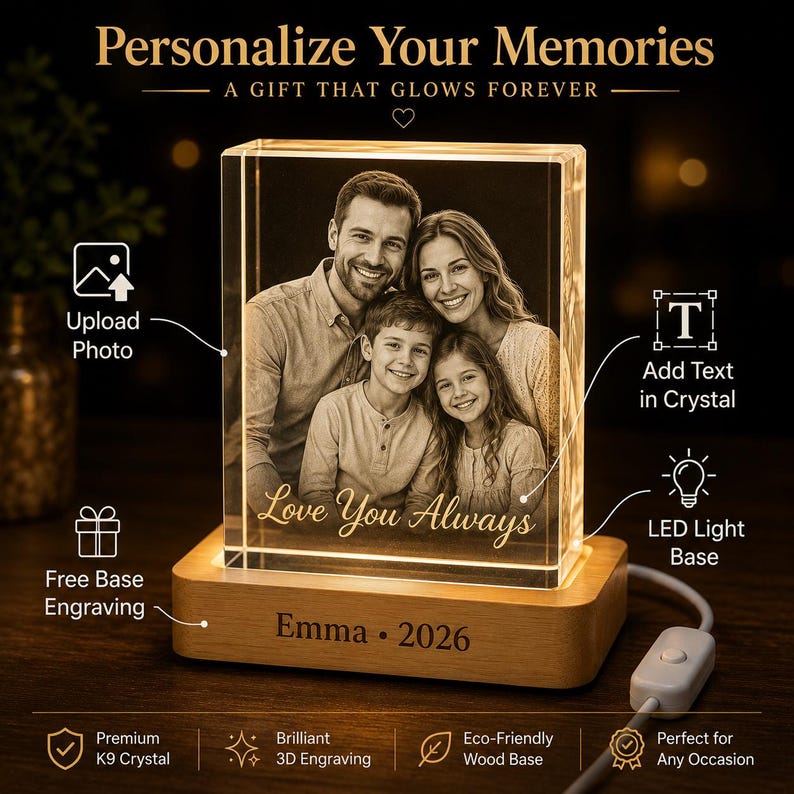 May include: A rectangular K9 crystal block featuring a 3D laser-engraved portrait of a family of four, illuminated by a light-colored wooden LED base. The crystal displays the text "Love You Always" and the wooden base is engraved with "Emma &bull; 2026".