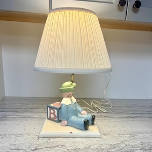 May include: A rustic wooden sign with the text "Welcome to our home" in white lettering. The sign features a distressed finish and a simple, inviting design, perfect for a front porch or entryway.