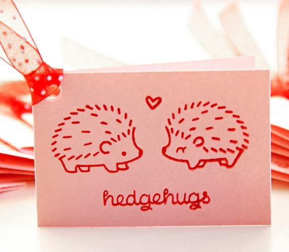 Valentines candle with a pair of hedgehogs