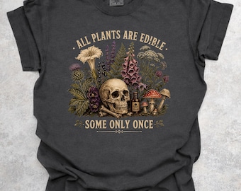 Camiseta con la frase "Todas las plantas son comestibles, algunas solo una vez"