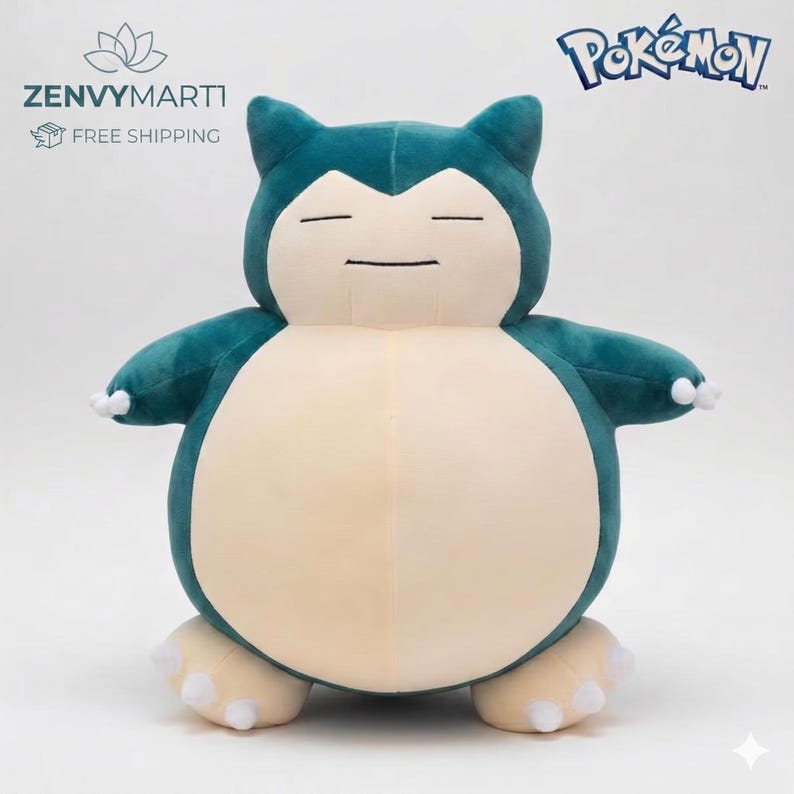 May include: A plush Snorlax Pok&eacute;mon character in teal and cream colors. The stuffed animal has a rounded body, closed eyes, and small arms and feet. The Pok&eacute;mon logo is visible in the upper right corner.