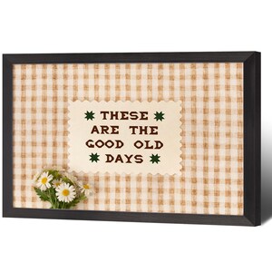 May include: A white ceramic mug with a black handle and the text "But First, Coffee" in a black, handwritten-style font. The mug is on a white surface.