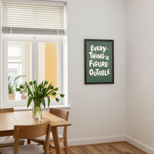 May include: A dining room scene with a wooden table and chairs, a vase of green tulips, and a framed sign that reads "EVERYTHING IS FIGURE-OUTABLE" in white lettering on a green background. A window with blinds is visible.