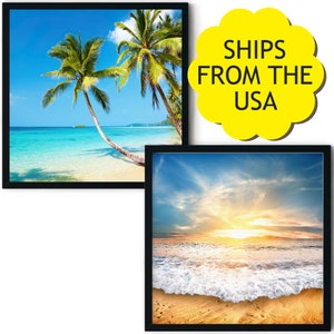May include: Two framed beach scene prints. The first print shows a tropical beach with palm trees and turquoise water. The second print shows a sunset over the ocean with waves crashing on the shore.