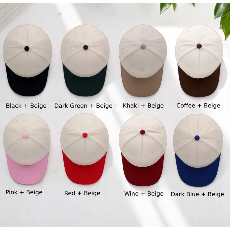 May include: Eight baseball caps arranged in two rows, each featuring a beige crown and a colored brim. The caps have a small button on top matching the brim color. The color combinations are labeled: Black + Beige, Dark Green + Beige, Khaki + Beige, Coffee + Beige, Pink + Beige, Red + Beige, Wine + Beige, and Dark Blue + Beige.