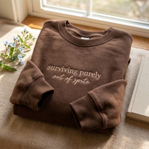 Embroidered Surviving Purely Out of Spite Sweatshirt – Empowered Women Mental Health Apparel