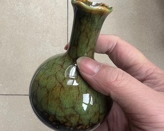 A unique, handcrafted, vintage-style ceramic vase with a distinctive glaze